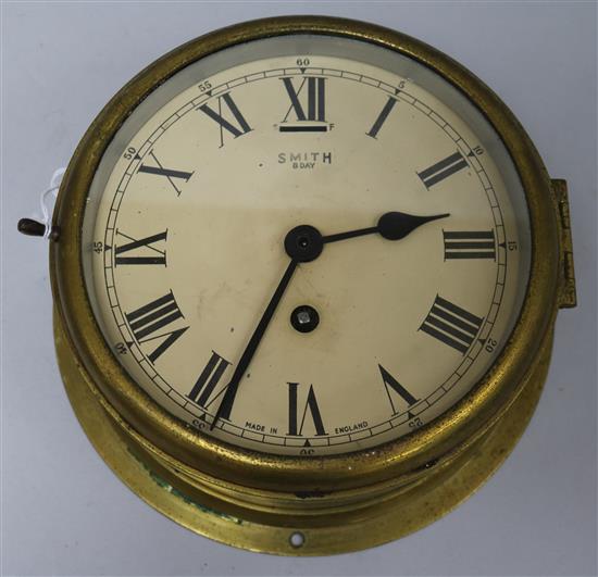 A Smiths brass bulkhead timepiece diameter 22.5cm